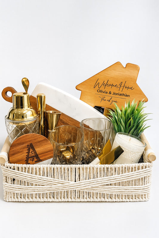 Kintoir luxury cocktail gift basket featuring gold barware, old-fashioned glasses, personalized cutting board, and decor.