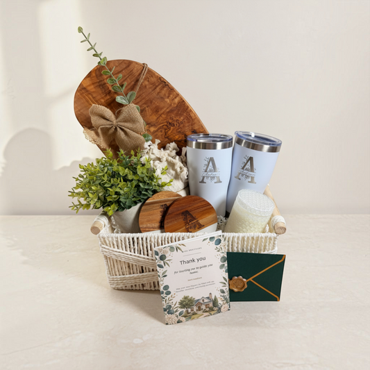 Grand Welcome personalized Realtor closing gift basket with olive wood board, two tumblers, coasters, candle, greenery and gift card