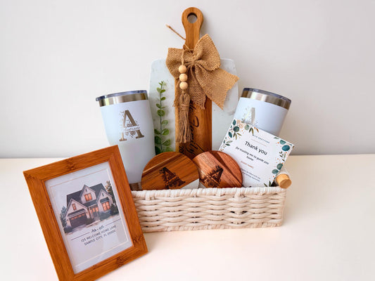 Personalized closing gift basket with framed new home keepsake and custom tumblers