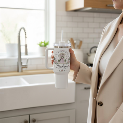 Personalized Realtor 40oz tumbler on neutral pedestal with floral styling