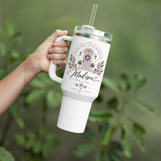 Personalized Realtor 40oz tumbler with floral real estate design held outdoors
