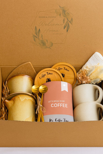 Kintoir Cozy Mornings coffee gift box featuring ceramic mugs, gold spoons, wooden coasters, and pour-over coffee maker.