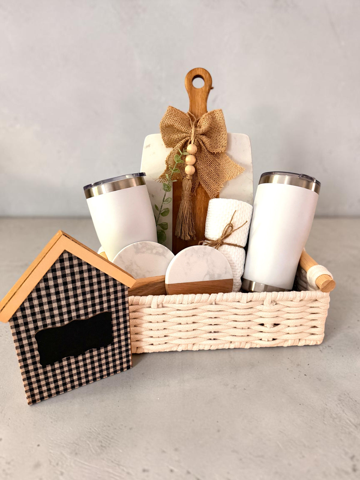 Closing Day Welcome client gift basket with tumblers, coasters and cutting board