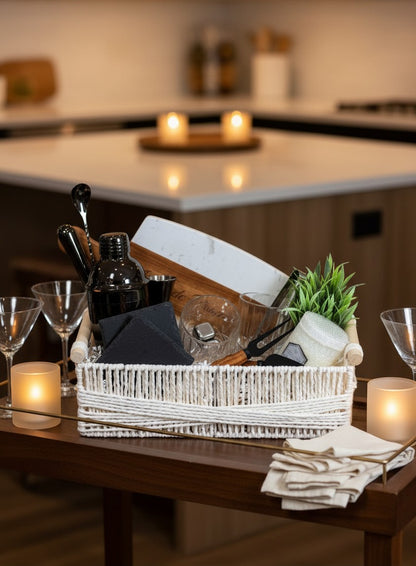 Kintoir luxury cocktail gift basket featuring a shaker, glasses, cutting board, and bar tools in a white woven basket.
