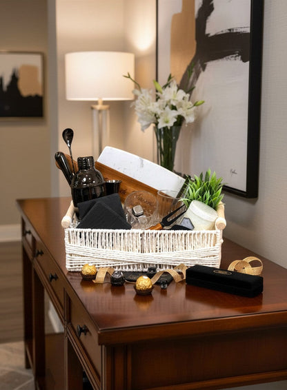 Kintoir luxury cocktail gift basket featuring a shaker, glasses, cutting board, and bar tools in a white woven basket.