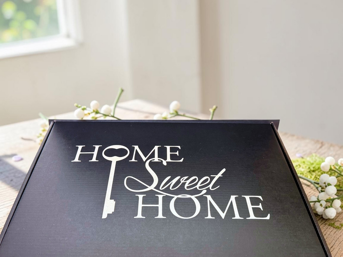 Made to Impress personalized client gift box contents including cutting board, coasters, keychains and thank-you note