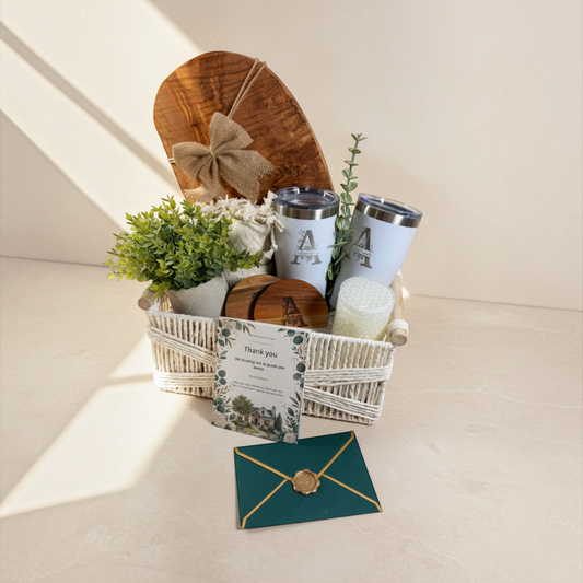 Luxury personalized closing gift basket with olive wood board, two tumblers, greenery and Realtor thank-you card