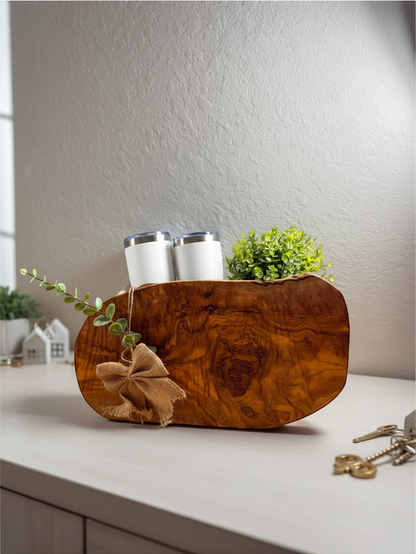 Olive wood serving board with burlap bow and greenery from Kintoir Grand Welcome ready-to-gift basket