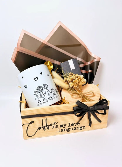 Kintoir personalized coffee gift box featuring a custom family mug, gold spoon, heart coaster, and dried flowers in a crate