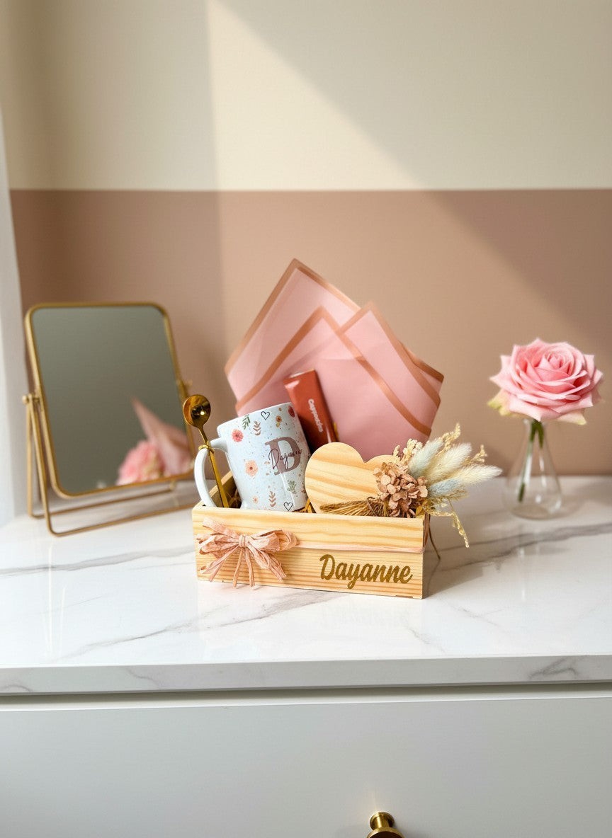 Kintoir personalized gift box in a pine crate with a floral mug, heart coaster, gold spoon, and dried flowers.