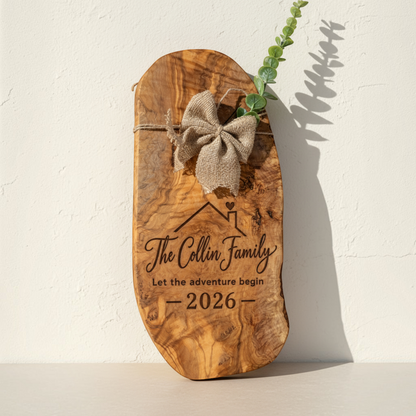 Personalized olive wood closing gift board with burlap bow, greenery and engraved new homeowner design