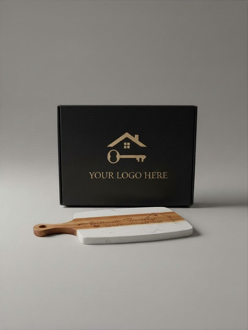 Kintoir personalized wood and marble cutting board with laser engraving in front of a branded black gift box.