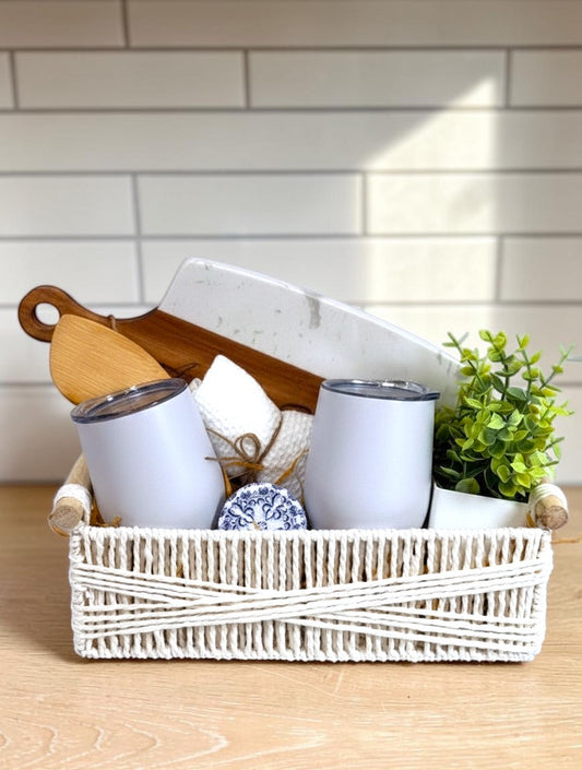 Kintoir Modern Home Celebration ready-to-gift new home gift basket with wine tumblers, cutting board, candle, and home accents.
