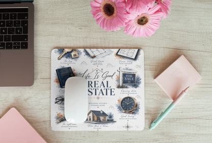Luxury real estate mouse pad styled with flowers and modern office accessories